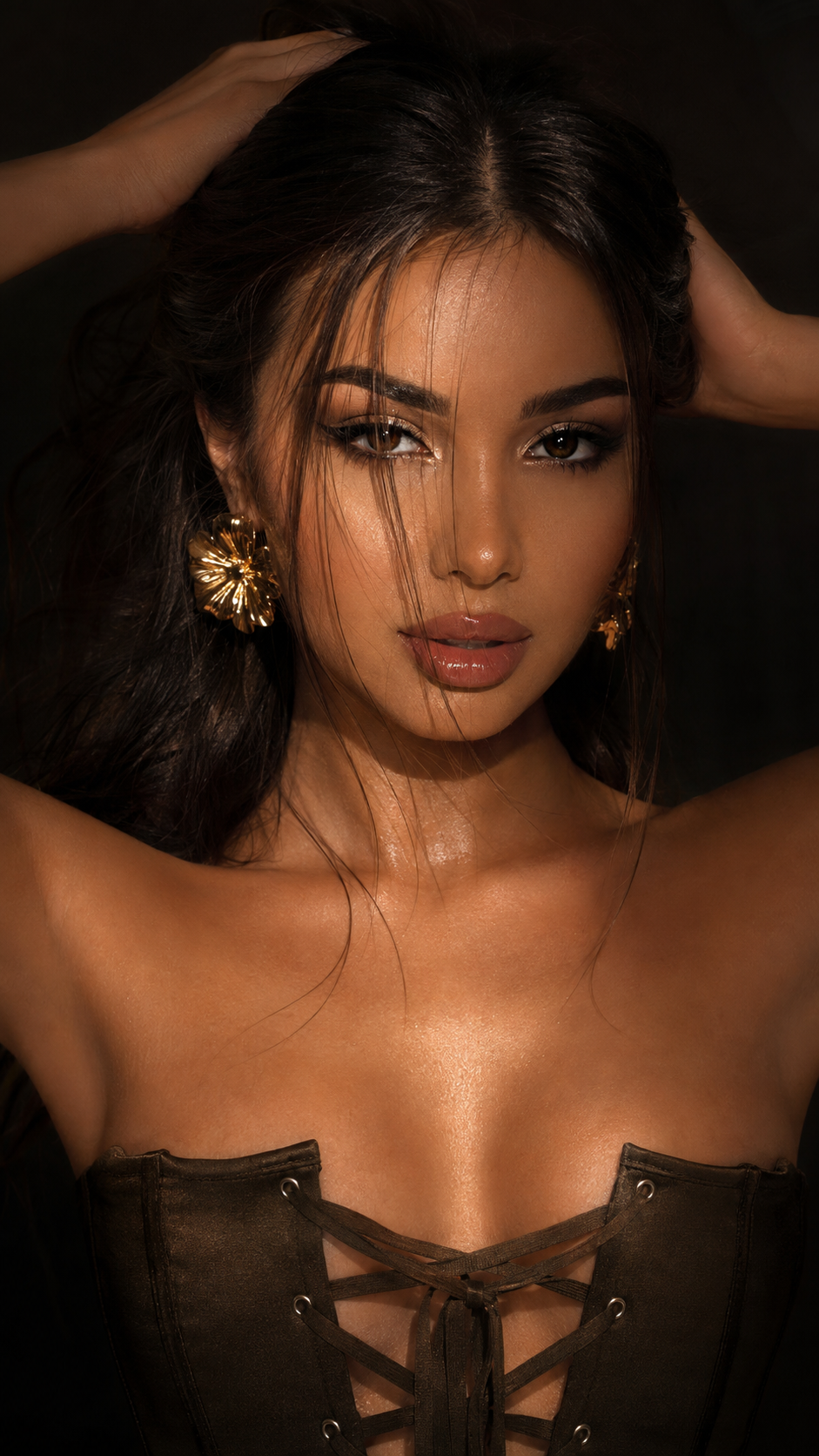 Beauty portrait with gold floral earrings and corset detail