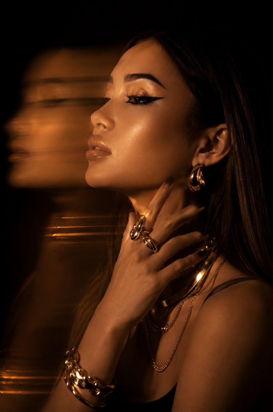 AI portrait: golden light profile with layered jewellery and motion blur